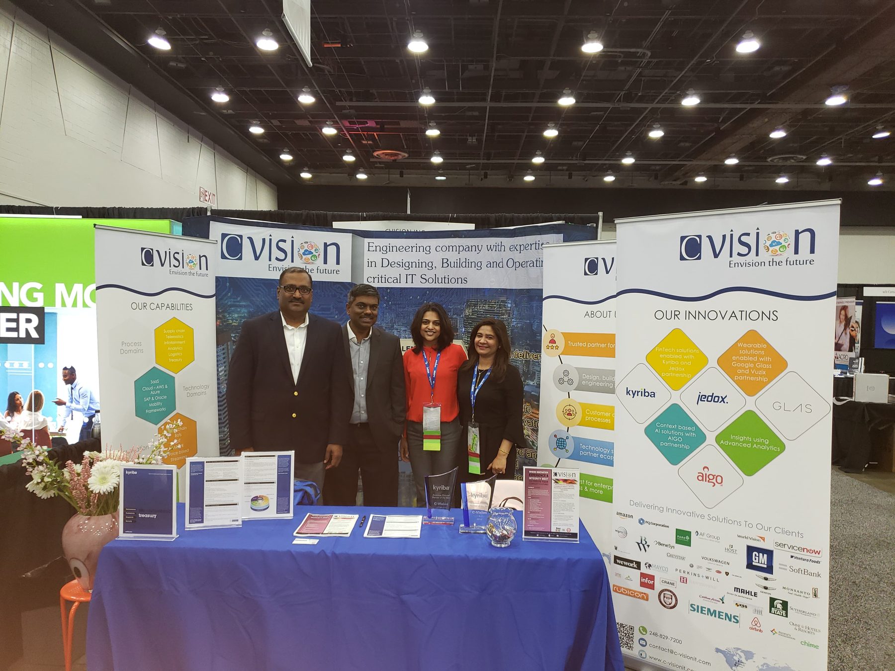 C-Vision team at a conference booth